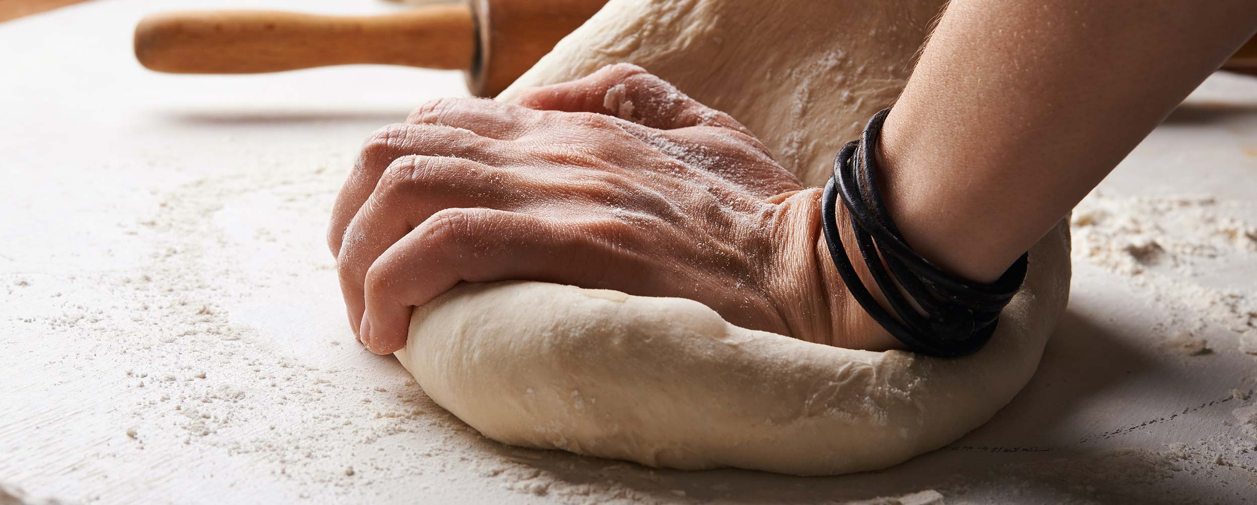 Pizza Dough Being Worked